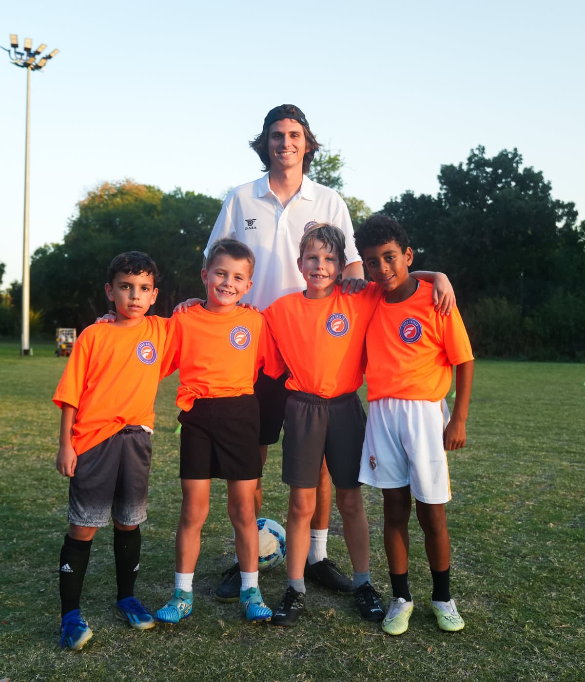 A Foro Skills coach working closely with young players on the field