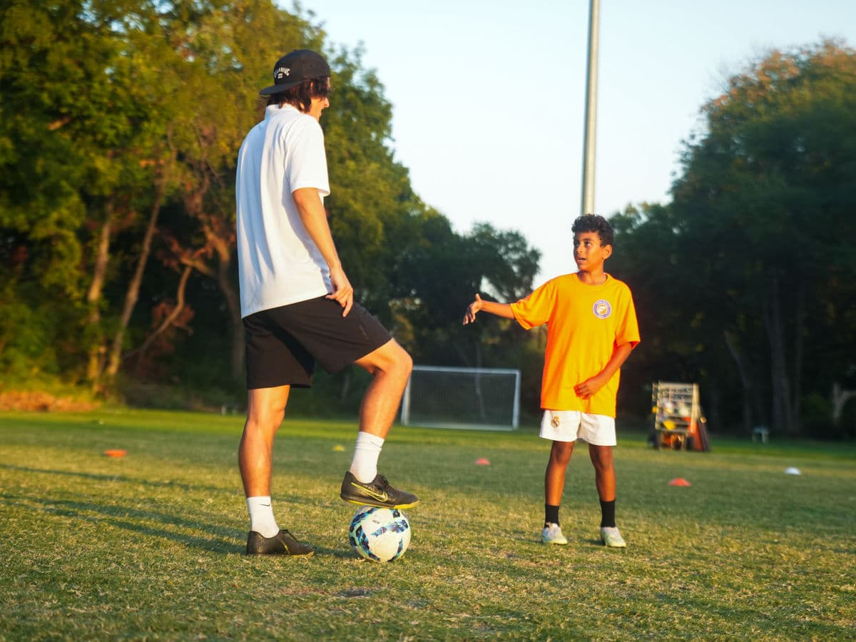 A Foro Skills coach leading a player through a training session