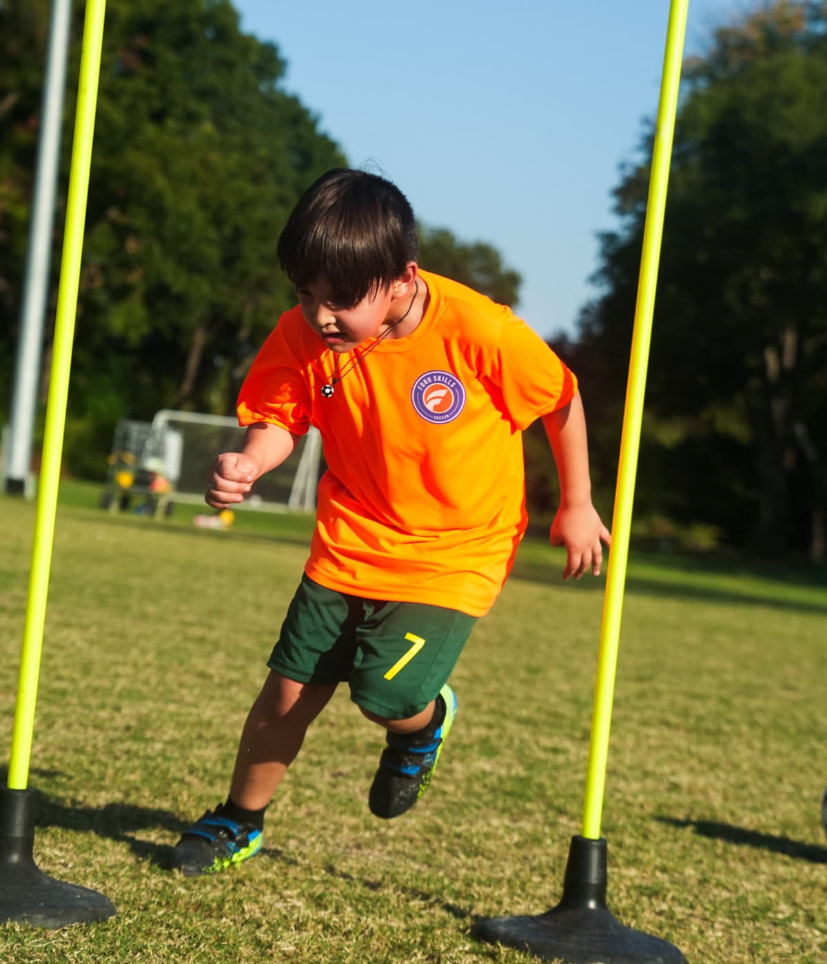 An older Foro player training on the sideline with a coach